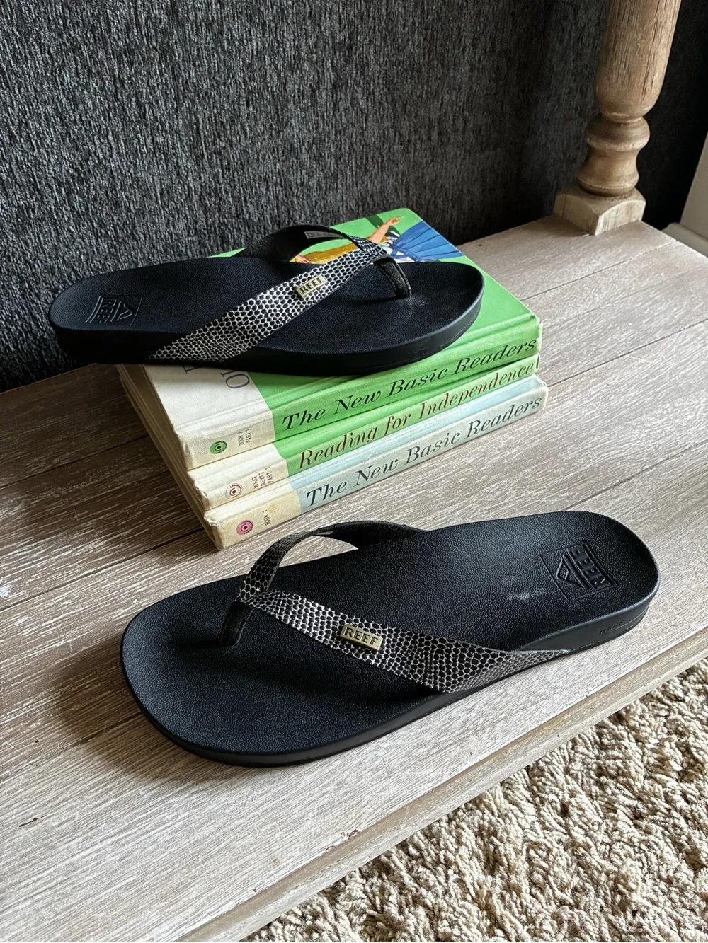 Reef Black Cushion Court Flip Flops with Snakeskin-Pattern Straps and Gold Logo